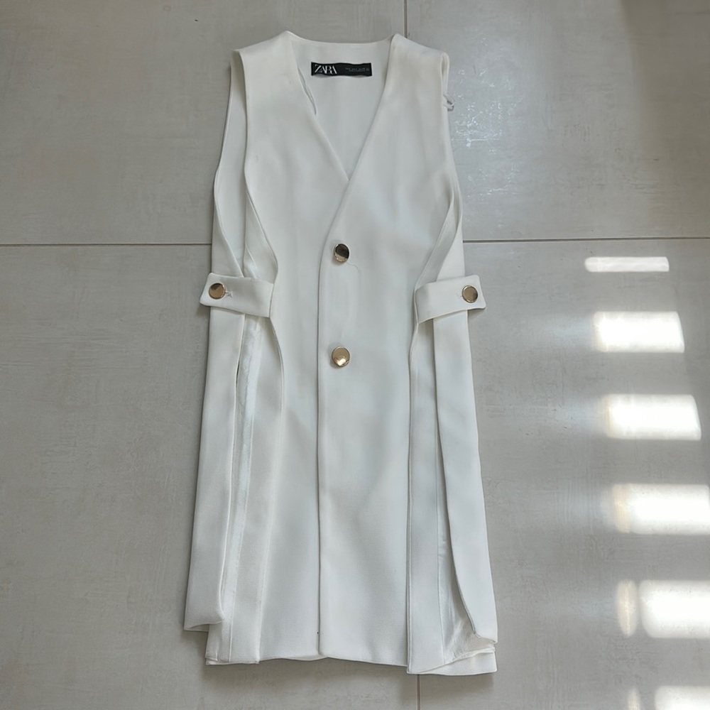 White with gold button up the center.